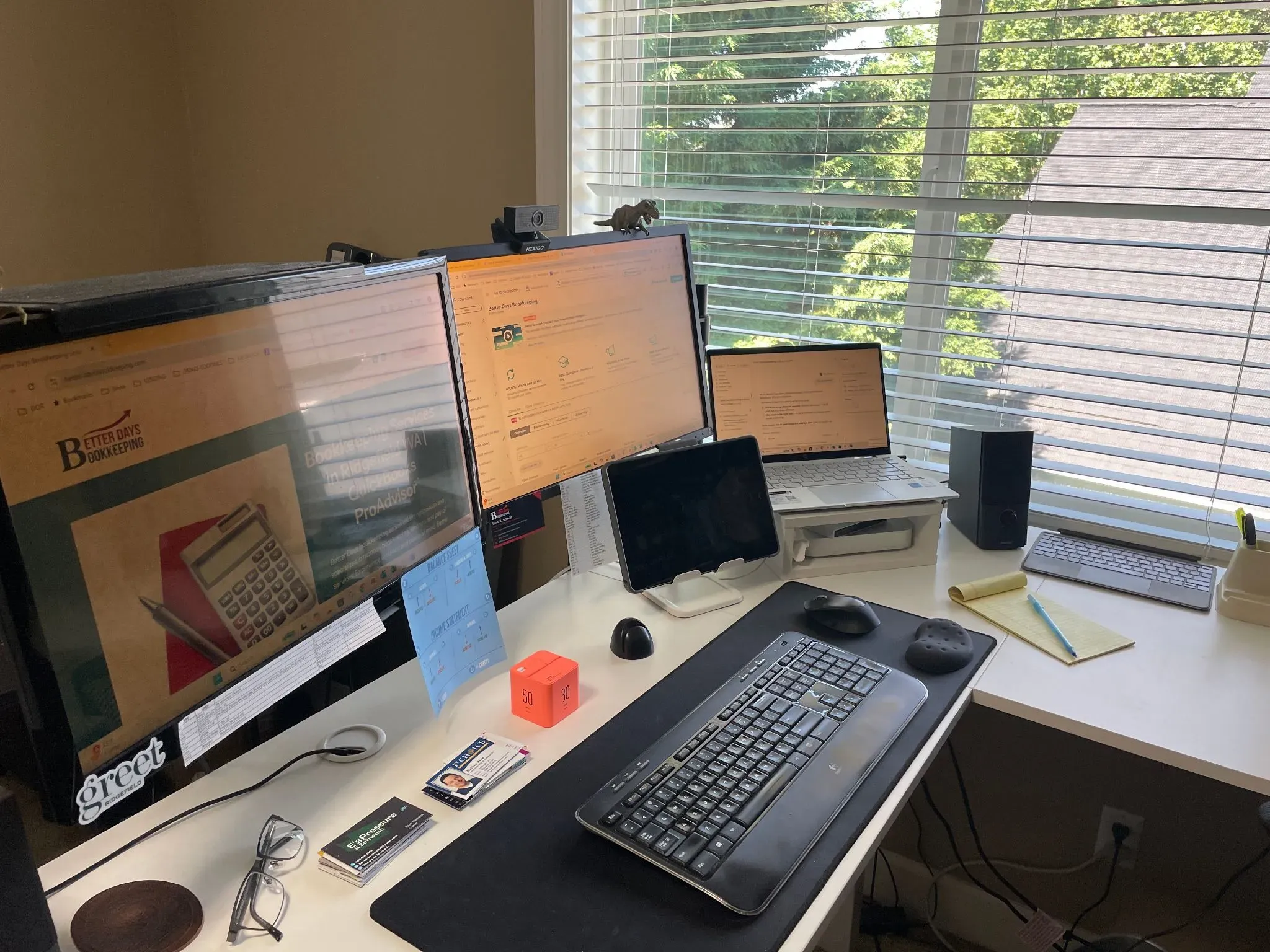 Mark’s actual Better Days Bookkeeping office, with multiple screens and workspace beside a window